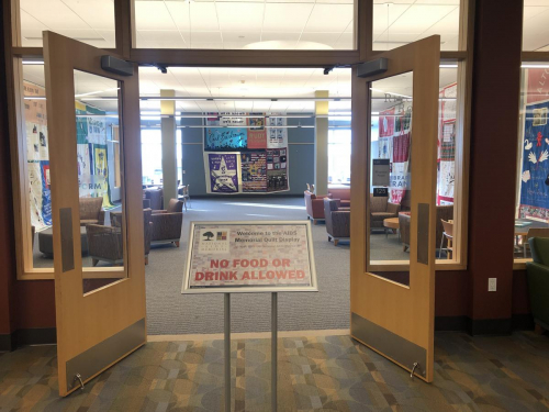 The entrance to the Riverside Room with a sign announcing the display and establishing that no food or drinks were allowed in the room during the length of the exhibit.